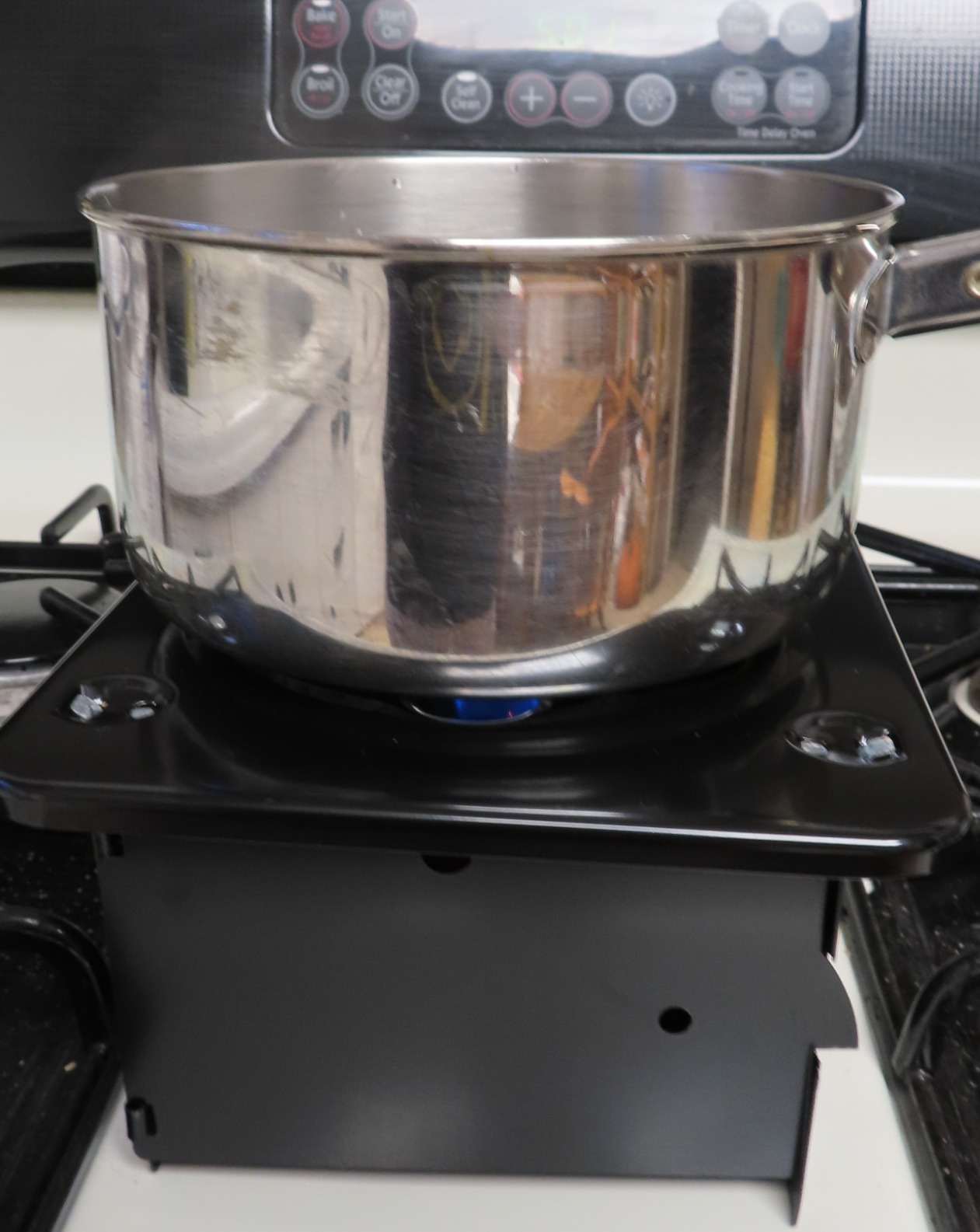 Coghlan's Portable Folding Camp Stove - Compact, Lightweight Steel Cooking Stove for Camping, Backpacking, Hiking, or Emergency Use - Uses Canned Heat or Fuel Tablets, Black customer photo 1