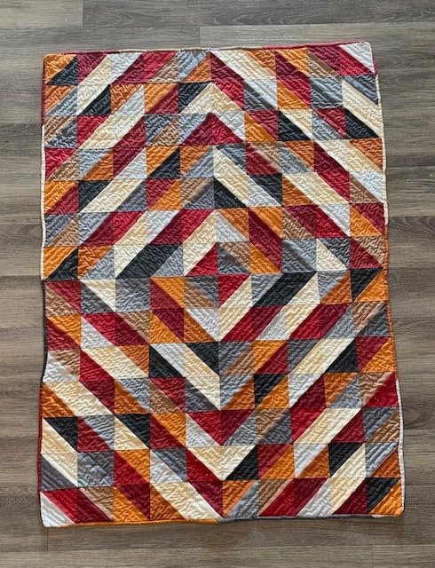 Connecting Threads Triangle Lap Throw Quilt Sewing Kit for Beginners | Kit contains 12 100% cotton fabric fat quarters, makes a throw size 40.5
