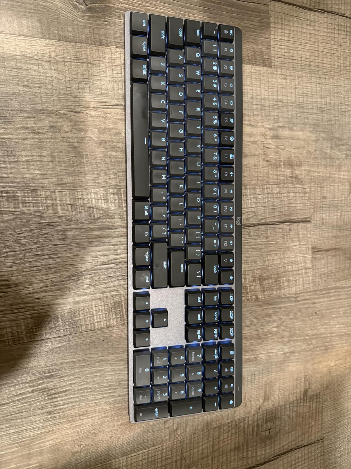Logitech MX Mechanical Wireless Illuminated Keyboard Tactile - Graphite | Low-profile full-size, 3 device Bluetooth pairing, Smart backlight auto-adjusts, USB-C rechargeable, Up to 15 day battery customer photo 1