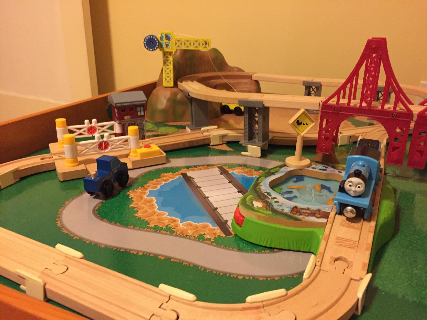 KidKraft Ride Around Town Wooden Train Set and Table with Helicopter, Airplane, Farm, Storage Bins and 100 Pieces, Compatible with Other Major Brand Trains, Honey customer photo 1