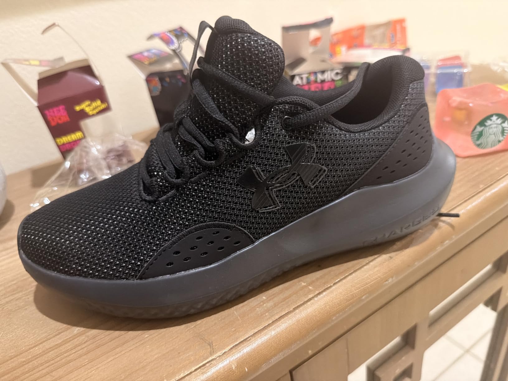 Under Armour Men's Charged Surge 4 Sneaker customer photo 1