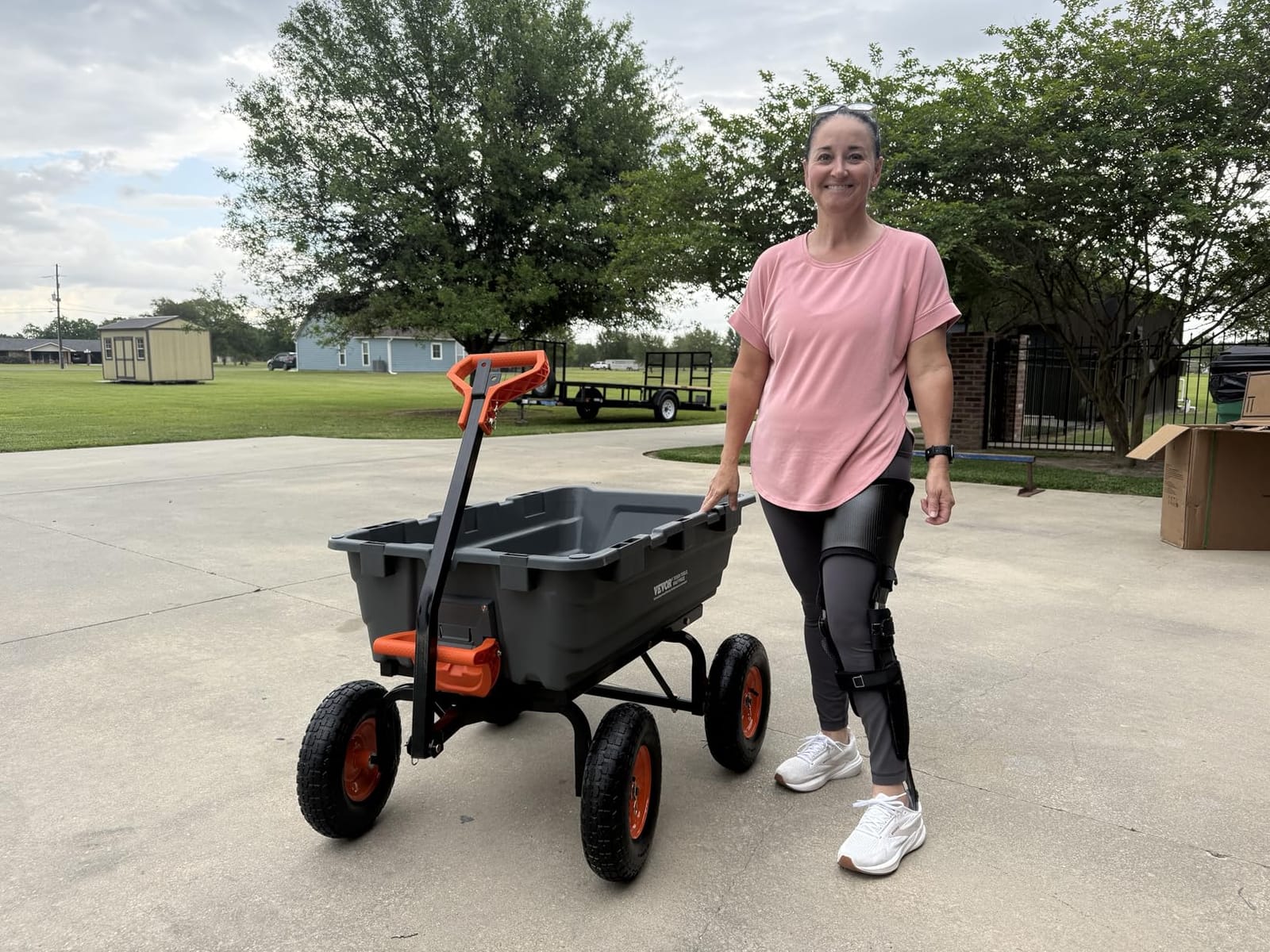 VEVOR Poly Garden Dump Cart 4 Cu.Ft. 600 lbs 4 Wheel Wheelbarrow Dump Wagon | For Orchard Farm, Adjustable Handle, Heavy Duty Yard Cart with 10 in All Terrain Wheels, Steel Frame & Quick Release System customer photo 1